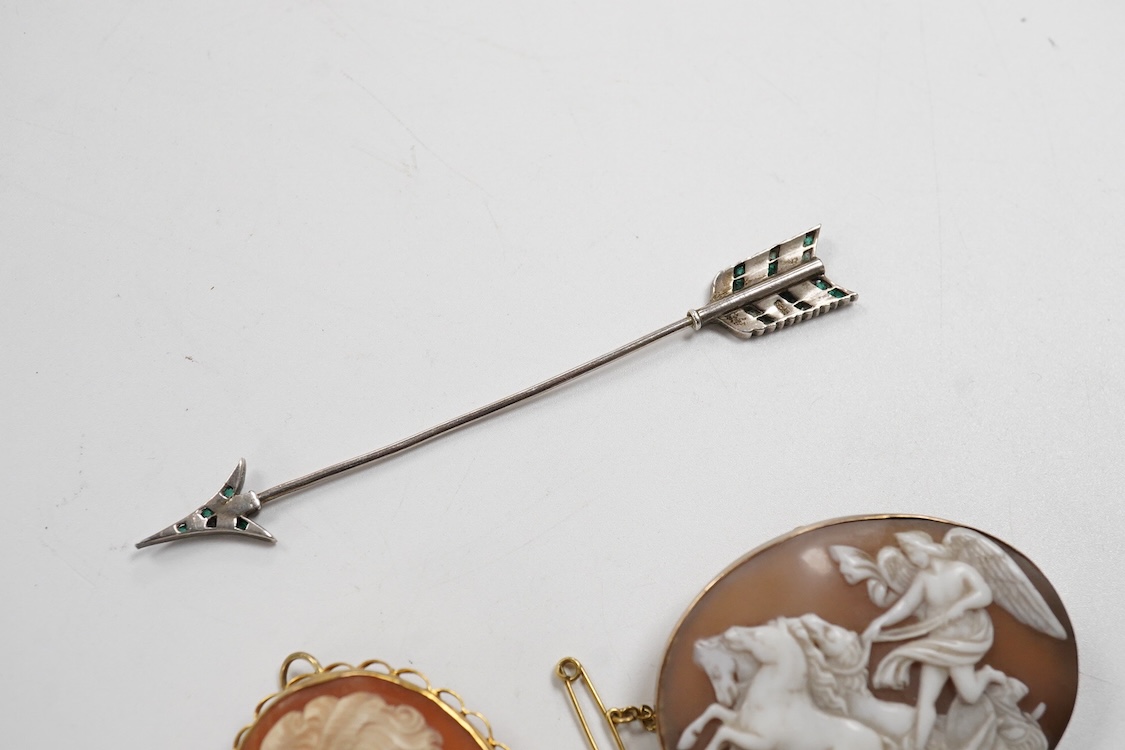 A collection of jewels, comprising: an Art Deco green and colourless paste jabot pin; two shell cameo brooches, depicting a lady in profile, length 4.7cm, stamped 9ct, and Sol's chariot respectively; and a gilt metal and